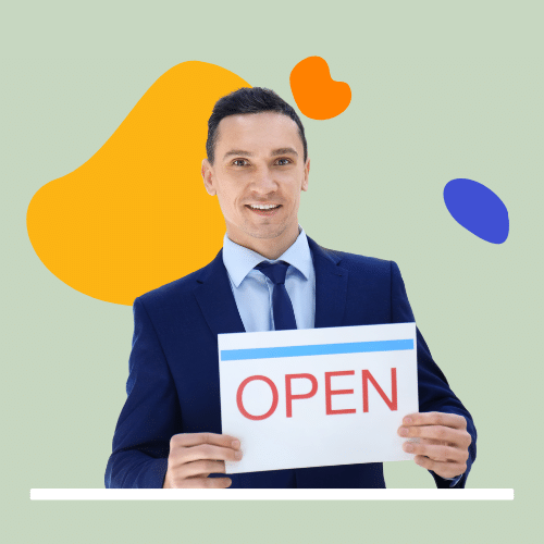 Person in suit holding open business sign