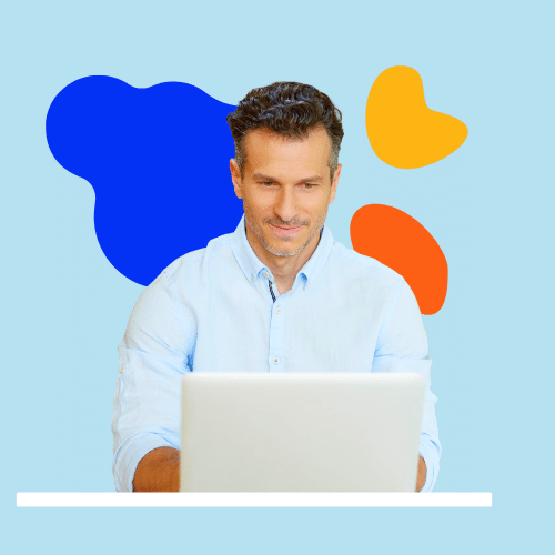 Person in blue shirt on computer Person in blue shirt on computer