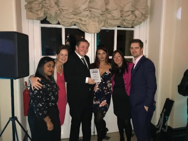 The Wellers' team celebrating the large employer award